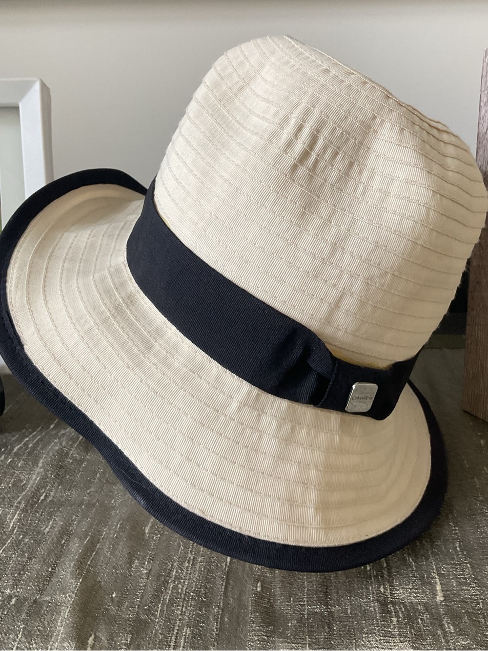 **Calvin Klein**Cream Ribbon-Trim Cloche Hat with Black Band